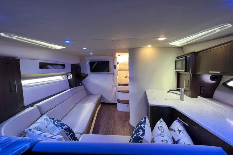  Yacht Photos Pics Luxurious interior of 2018 Regal 35 Sport Coupe with modern kitchen and seating area.