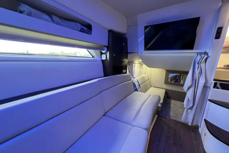 Yacht Photos Pics Interior of 2018 Regal 35 Sport Coupe with modern seating and mounted TV.