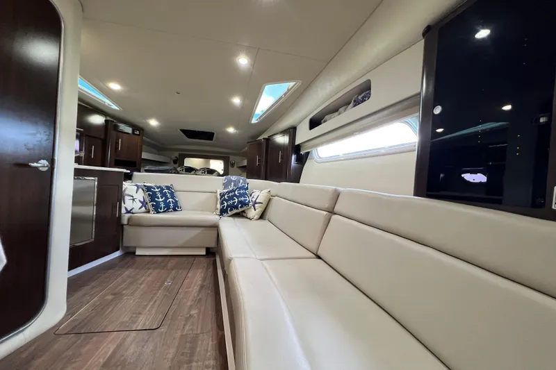  Yacht Photos Pics Luxurious interior of 2018 Regal 35 Sport Coupe with plush seating and nautical decor.