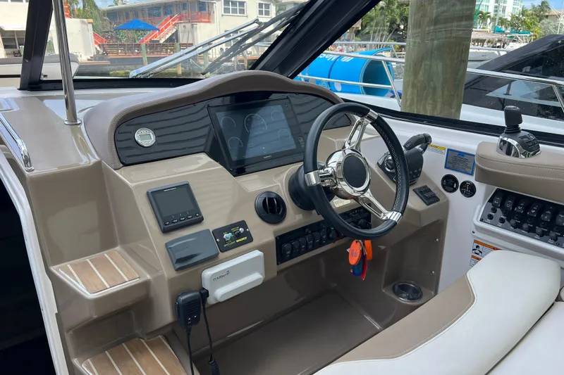  Yacht Photos Pics 2018 Regal 35 Sport Coupe dashboard with steering wheel and control panel.