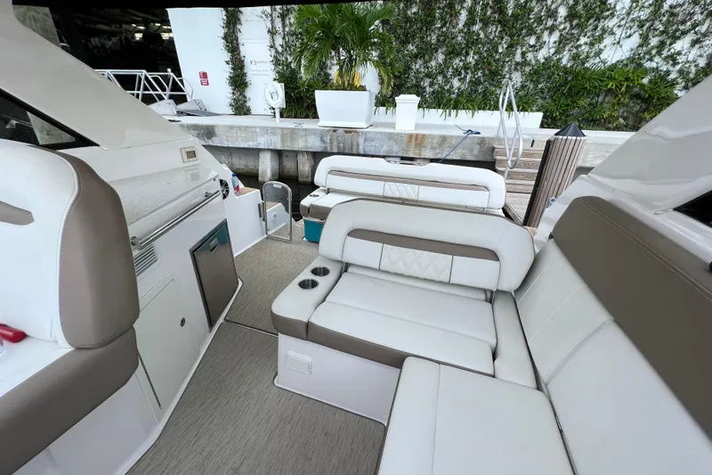  Yacht Photos Pics 2018 Regal 35 Sport Coupe interior with white seating and modern amenities.