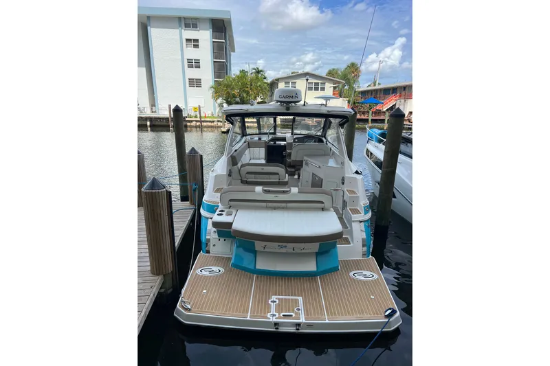  Yacht Photos Pics 2018 Regal 35 Sport Coupe docked, showcasing spacious deck and modern design.