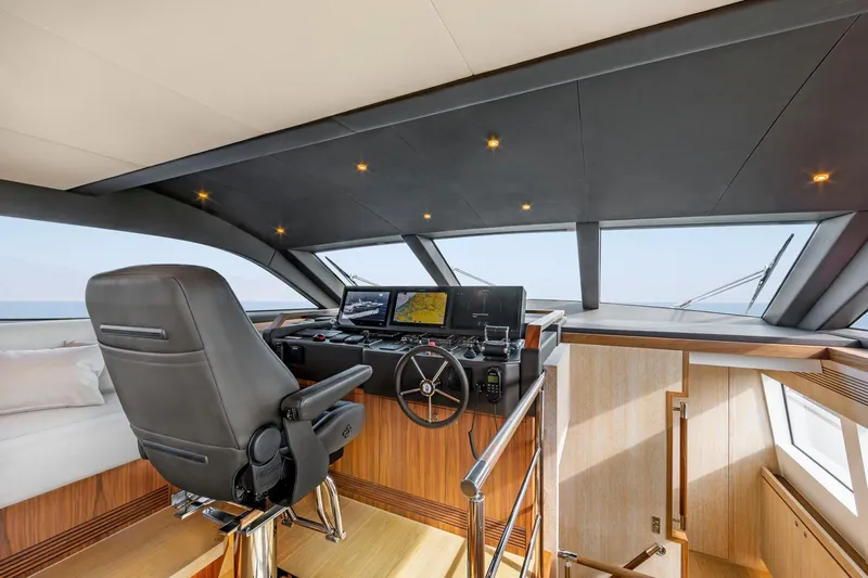 Helga Yacht Photos Pics Luxurious Van der Valk 2021 Raised Pilothouse interior with modern helm and navigation equipment.