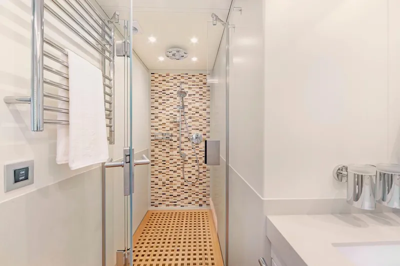 Helga Yacht Photos Pics Luxurious yacht bathroom with modern shower, elegant fixtures, and stylish tile design, Van der Valk 2021.