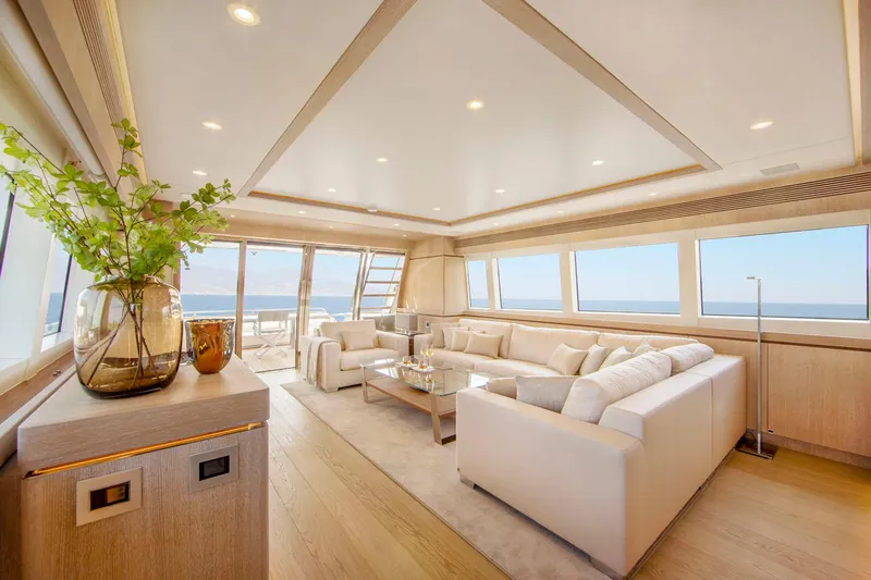 Helga Yacht Photos Pics Luxurious interior of 2021 Van der Valk RAISED PILOTHOUSE yacht with elegant seating and ocean view.