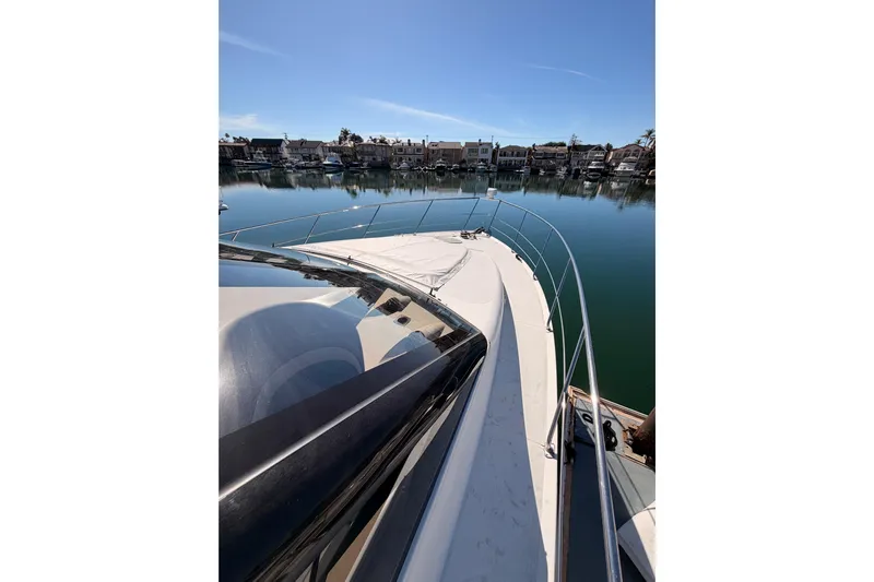 Le Reve Yacht Photos Pics 1999 Carver 530 Voyager Pilothouse yacht docked in a serene marina setting.