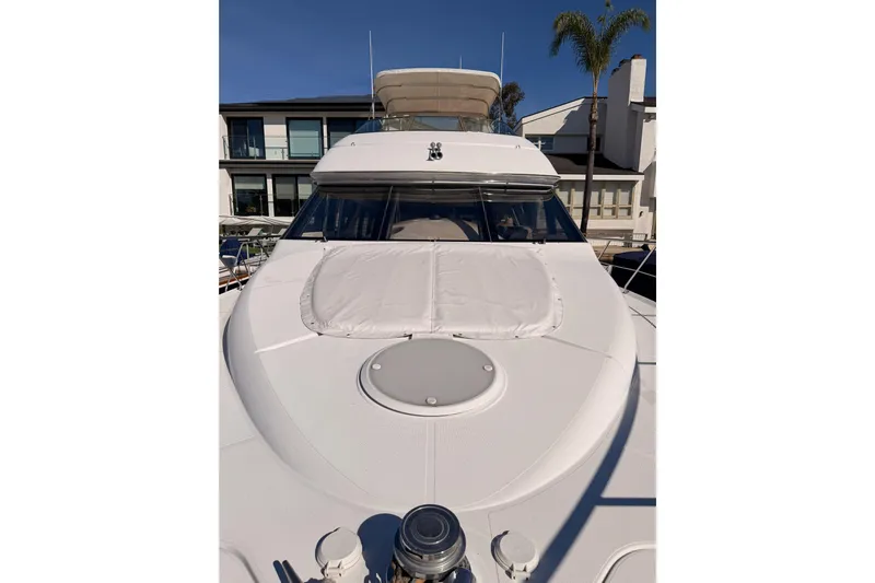 Le Reve Yacht Photos Pics 1999 Carver 530 Voyager Pilothouse yacht docked, showcasing sleek design and spacious deck.