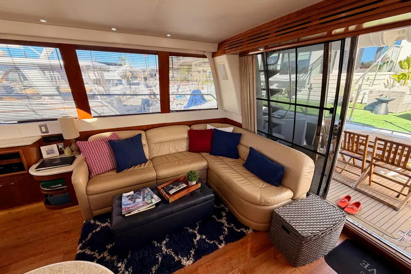 Le Reve Yacht Photos Pics Luxurious interior of 1999 Carver 530 Voyager Pilothouse with leather seating and nautical decor.