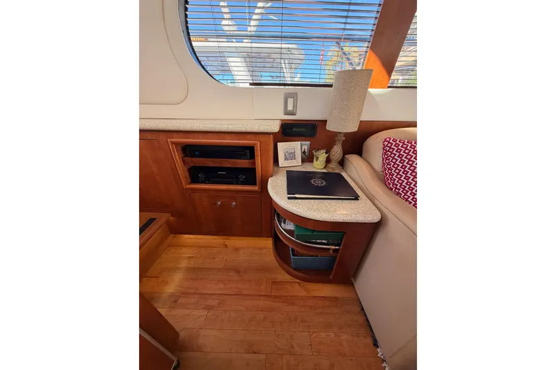 Le Reve Yacht Photos Pics Interior of 1999 Carver 530 Voyager Pilothouse with wood cabinetry and decorative elements.