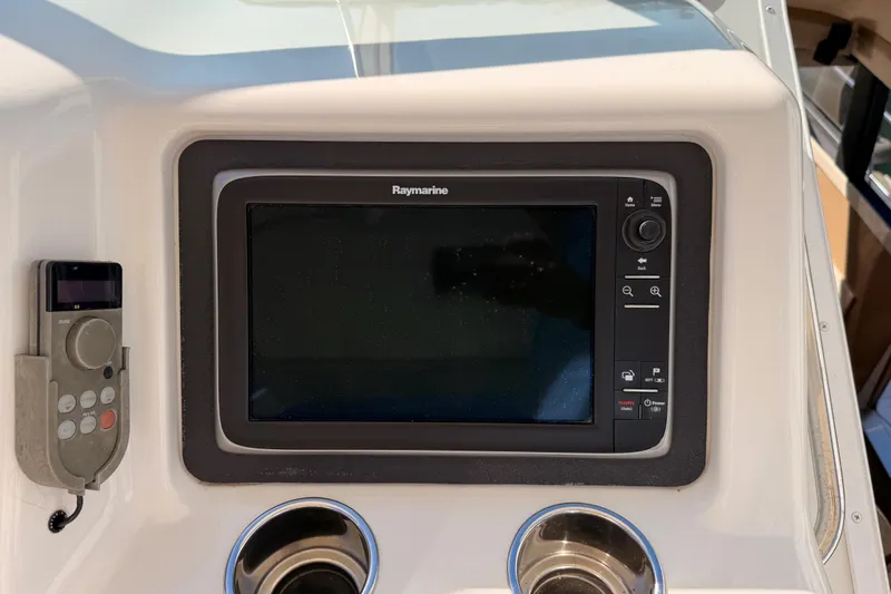 Le Reve Yacht Photos Pics Raymarine navigation system on 1999 Carver 530 Voyager Pilothouse yacht dashboard.