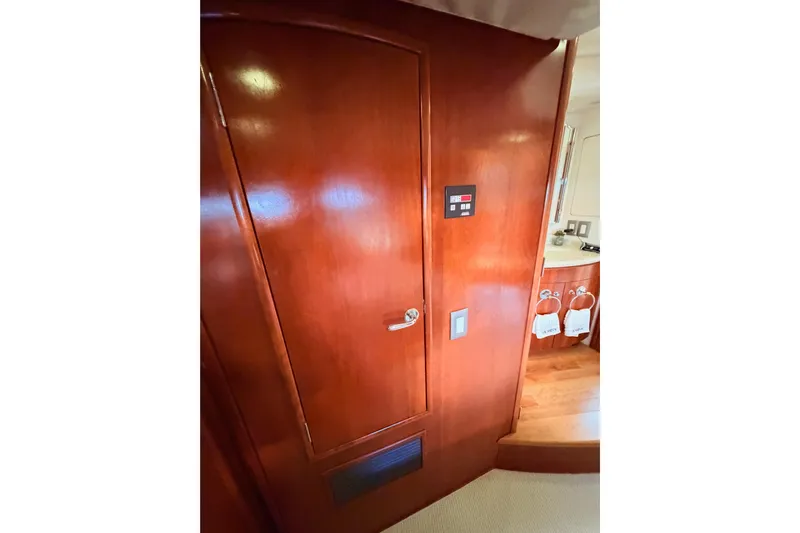 Le Reve Yacht Photos Pics Interior of 1999 Carver 530 Voyager Pilothouse with wooden door and control panel.