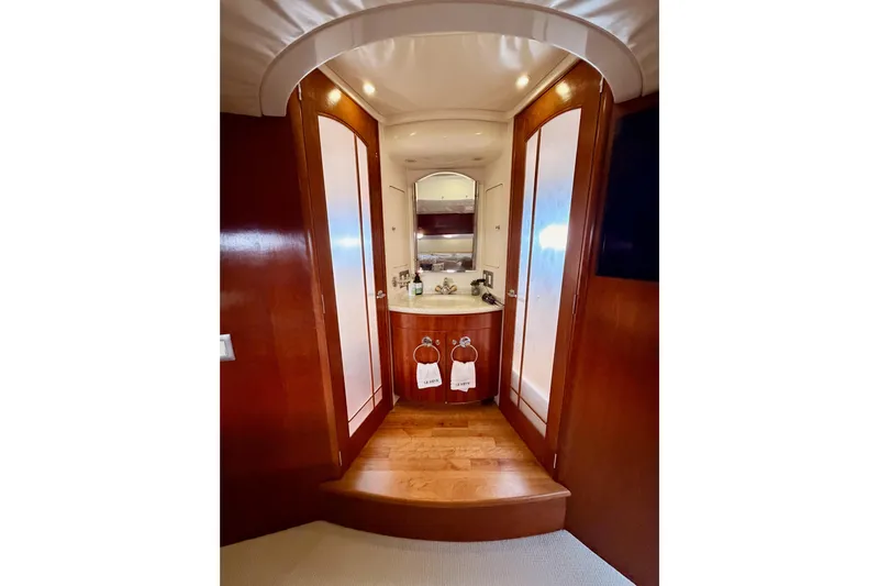 Le Reve Yacht Photos Pics Luxurious bathroom interior of 1999 Carver 530 Voyager Pilothouse yacht with wooden finishes.
