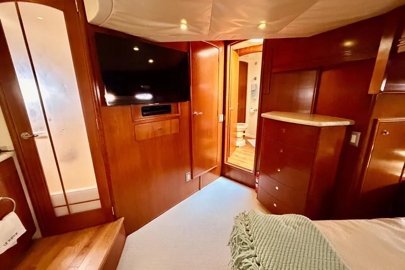 Le Reve Yacht Photos Pics Luxurious interior of 1999 Carver 530 Voyager Pilothouse with wood finish and modern amenities.