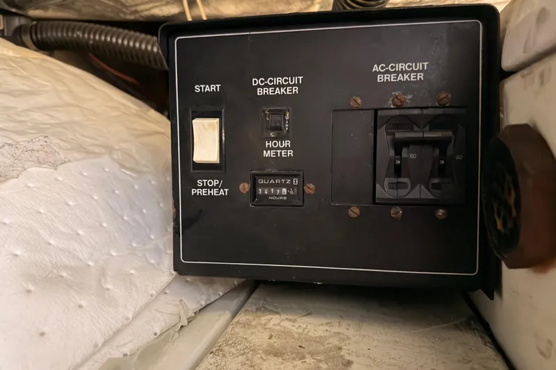 Le Reve Yacht Photos Pics Control panel of a 1999 Carver 530 Voyager Pilothouse with circuit breakers and hour meter.