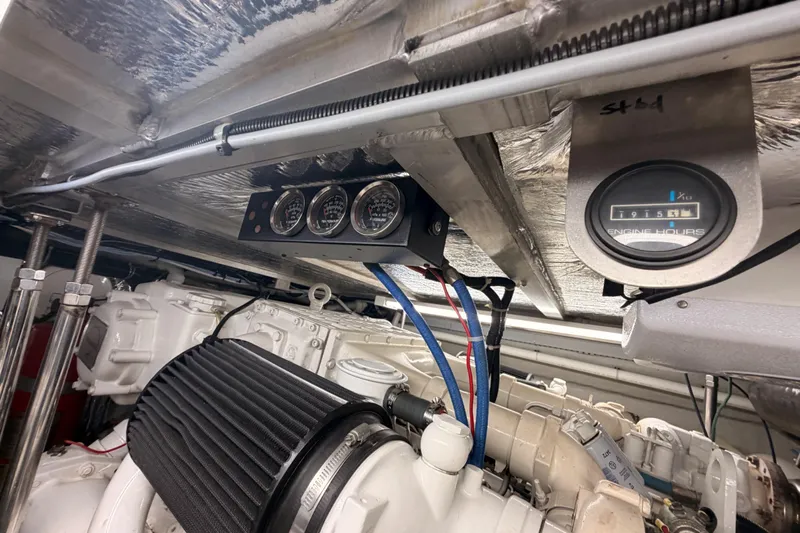 Le Reve Yacht Photos Pics Engine room of 1999 Carver 530 Voyager Pilothouse with gauges and engine hour meter.