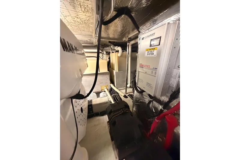 Le Reve Yacht Photos Pics Engine room of 1999 Carver 530 Voyager Pilothouse with electrical systems and wiring.