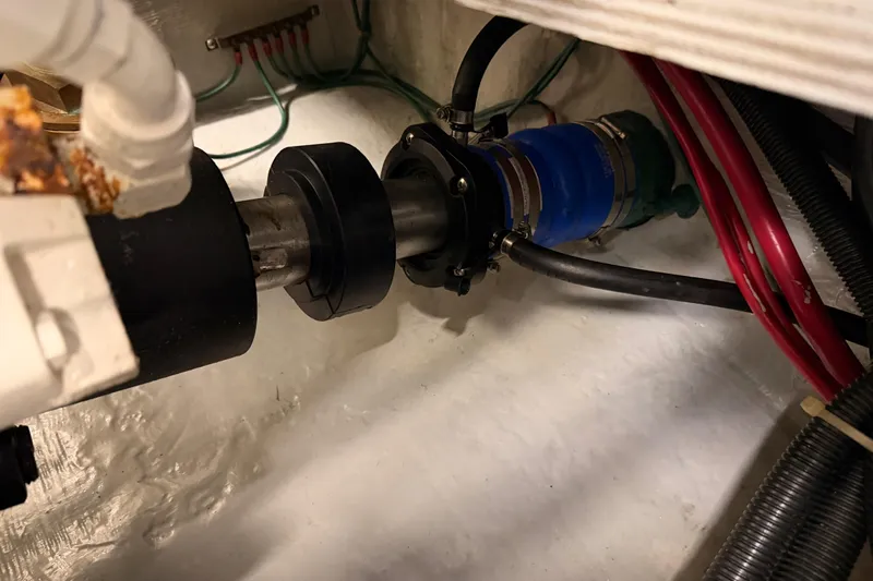 Le Reve Yacht Photos Pics Engine compartment of 1999 Carver 530 Voyager Pilothouse with visible mechanical components.