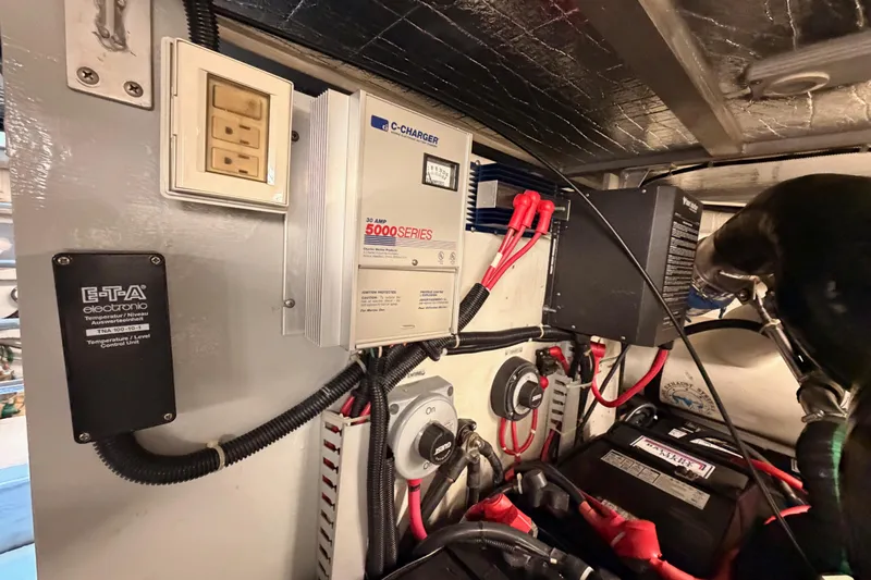 Le Reve Yacht Photos Pics Electrical system inside 1999 Carver 530 Voyager Pilothouse, featuring chargers and control units.