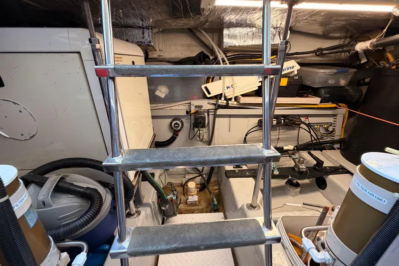 Le Reve Yacht Photos Pics Engine room of 1999 Carver 530 Voyager Pilothouse with ladder and equipment.