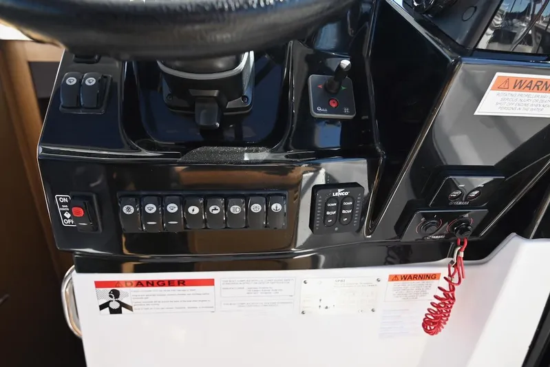Shantytown Yacht Photos Pics Control panel of 2020 Jeanneau NC 895 boat with various switches and warning labels.