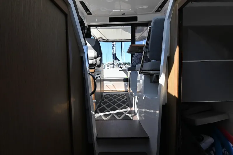 Shantytown Yacht Photos Pics Interior view of 2020 Jeanneau NC 895 boat, featuring seating and modern design.