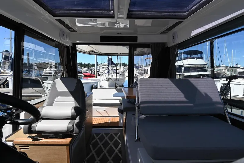 Shantytown Yacht Photos Pics Interior of 2020 Jeanneau NC 895 boat with seating and marina view.