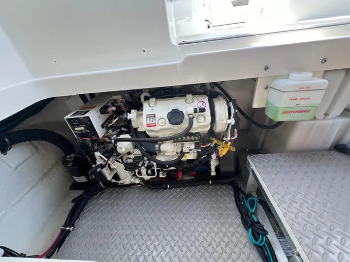 Touch Of Grey Yacht Photos Pics Engine compartment of 2022 Sea Ray Sundancer 320 OB with visible components and wiring.
