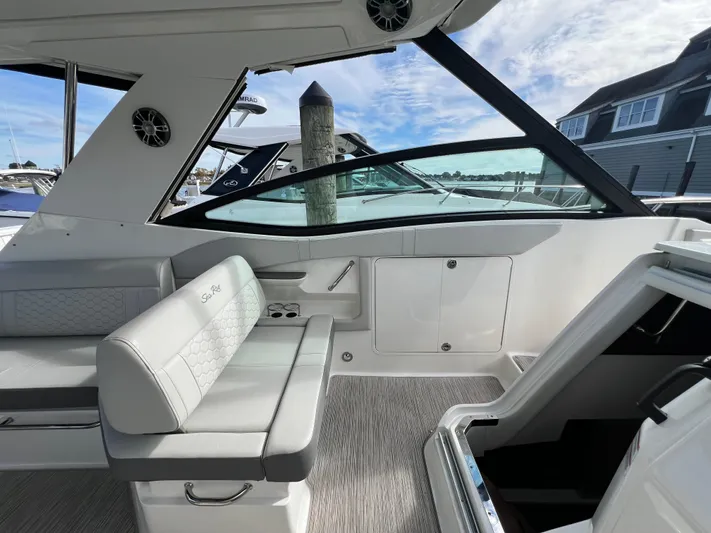 Touch Of Grey Yacht Photos Pics 2022 Sea Ray Sundancer 320 OB interior with seating and open cabin entry.