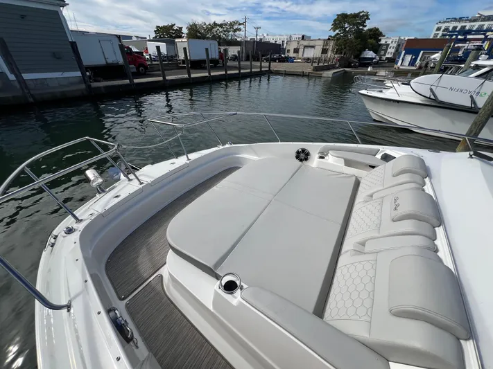 Touch Of Grey Yacht Photos Pics 2022 Sea Ray Sundancer 320 OB boat with spacious deck seating in marina.