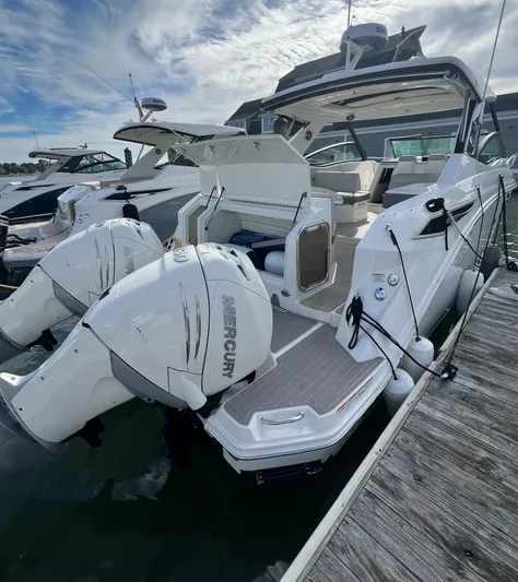 Touch Of Grey Yacht Photos Pics 2022 Sea Ray Sundancer 320 OB with dual Mercury outboard engines docked at marina.