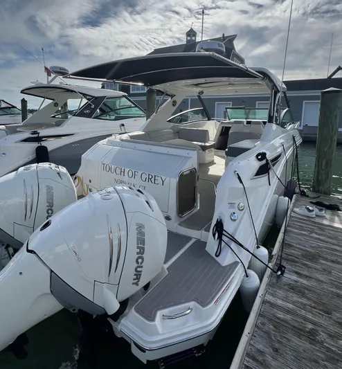 Touch Of Grey Yacht Photos Pics 2022 Sea Ray Sundancer 320 OB docked, featuring dual Mercury outboard engines.