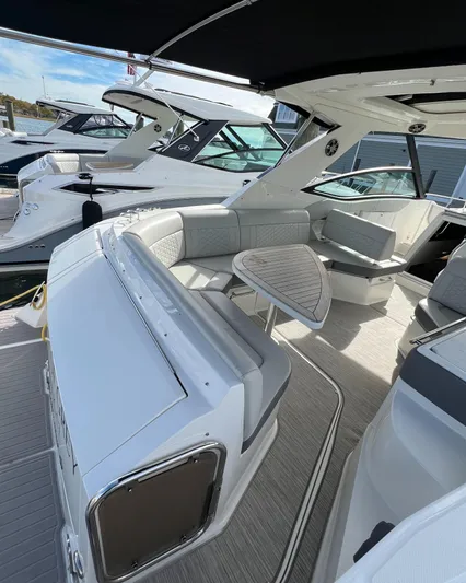 Touch Of Grey Yacht Photos Pics 2022 Sea Ray Sundancer 320 OB interior with sleek seating and modern design.