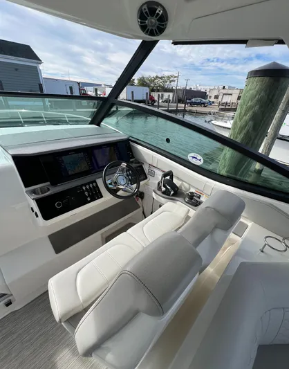 Touch Of Grey Yacht Photos Pics 2022 Sea Ray Sundancer 320 OB cockpit with modern controls and dual seating.