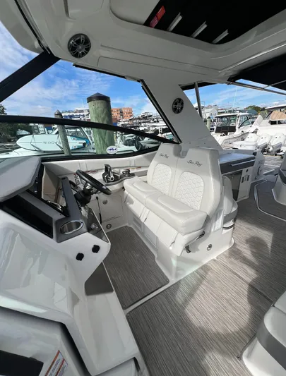 Touch Of Grey Yacht Photos Pics Interior of 2022 Sea Ray Sundancer 320 OB, featuring modern helm and seating.