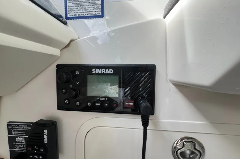 Touch Of Grey Yacht Photos Pics Simrad marine radio on 2022 Sea Ray Sundancer 320 OB dashboard.
