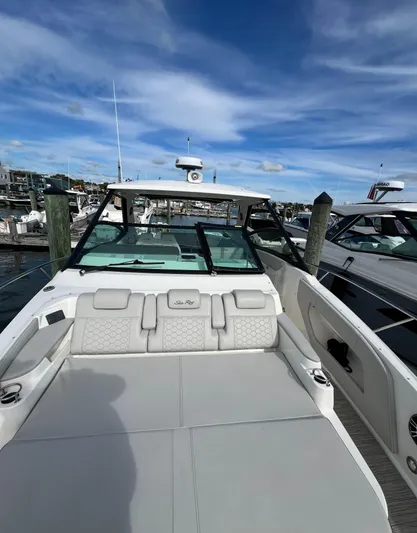 Touch Of Grey Yacht Photos Pics 2022 Sea Ray Sundancer 320 OB at marina, featuring spacious deck and modern design.