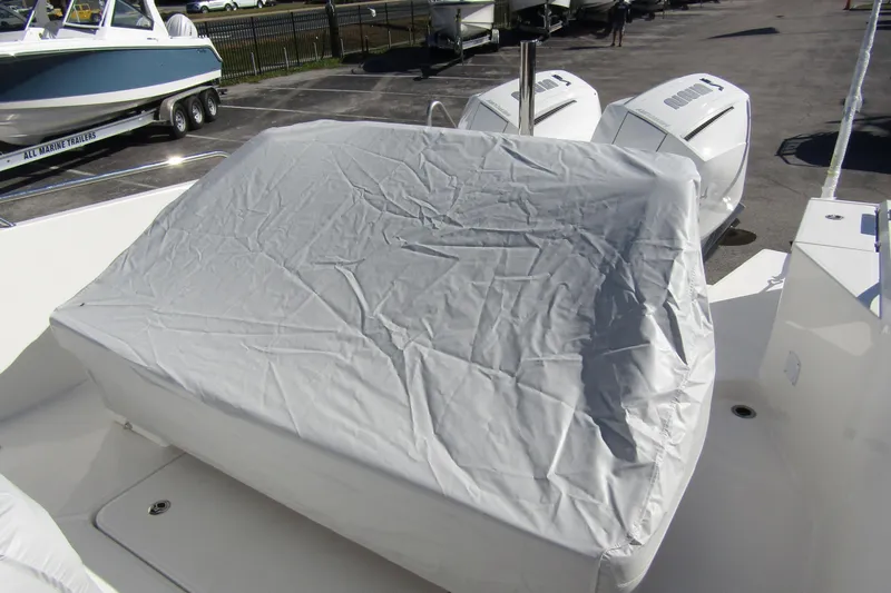  Yacht Photos Pics Covered engine area of a 2025 Nimbus Tender 9 boat in a parking lot.