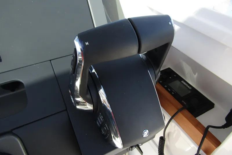  Yacht Photos Pics Throttle control of 2025 Nimbus Tender 9 boat, featuring sleek design and modern technology.