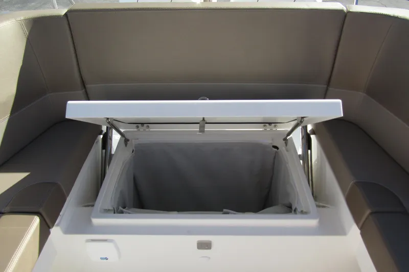 Yacht Photos Pics Open storage compartment on Nimbus Tender 9 boat, 2025 model, with cushioned seating.