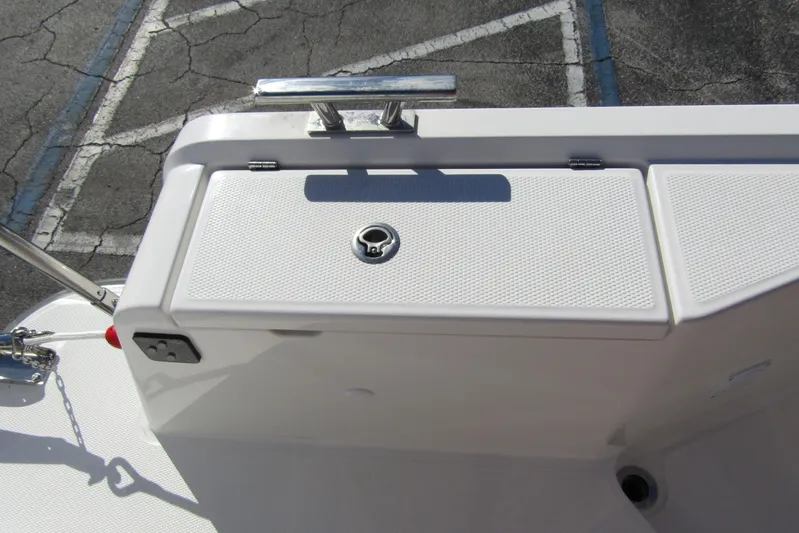  Yacht Photos Pics Close-up of a 2025 Nimbus Tender 9 boat deck with storage compartment.