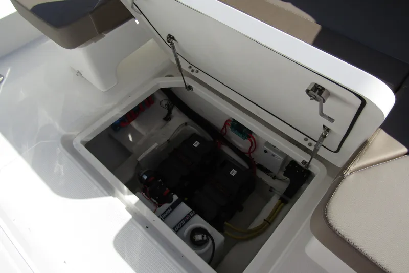  Yacht Photos Pics Open storage compartment in a 2025 Nimbus Tender 9 boat, revealing internal components.