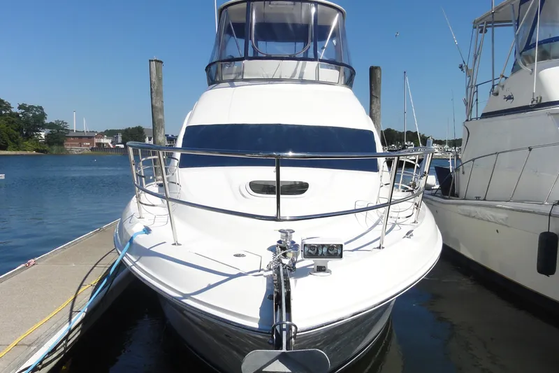  Yacht Photos Pics 2007 Sea Ray 36 Sedan Bridge yacht docked at marina, front view.