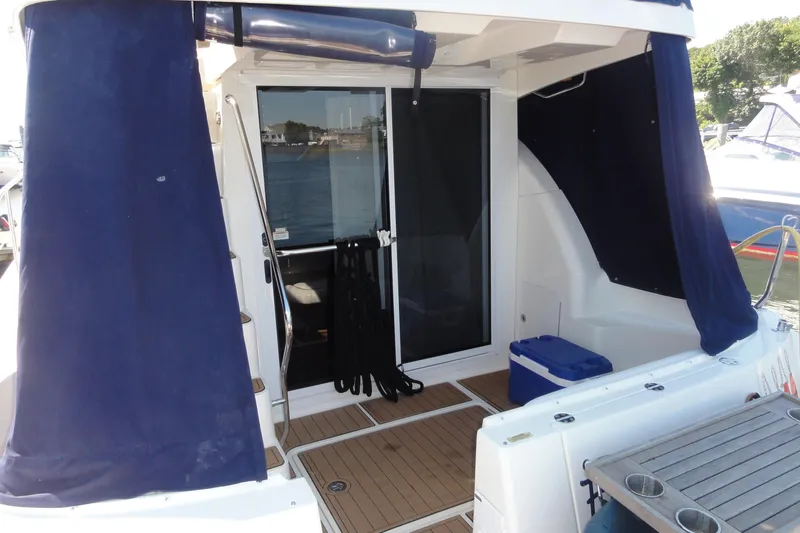  Yacht Photos Pics 2007 Sea Ray 36 Sedan Bridge yacht with blue curtains and deck view.