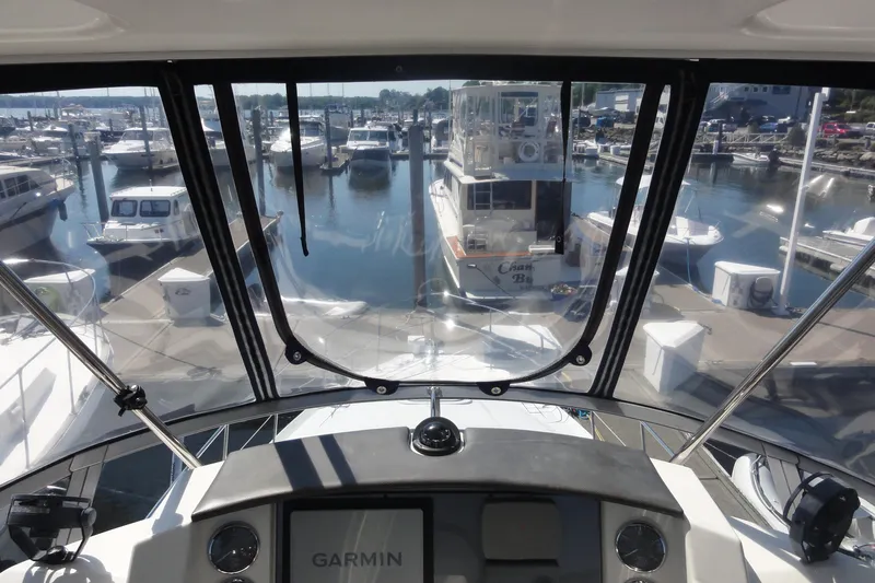  Yacht Photos Pics View from 2007 Sea Ray 36 Sedan Bridge cockpit overlooking marina with various boats docked.