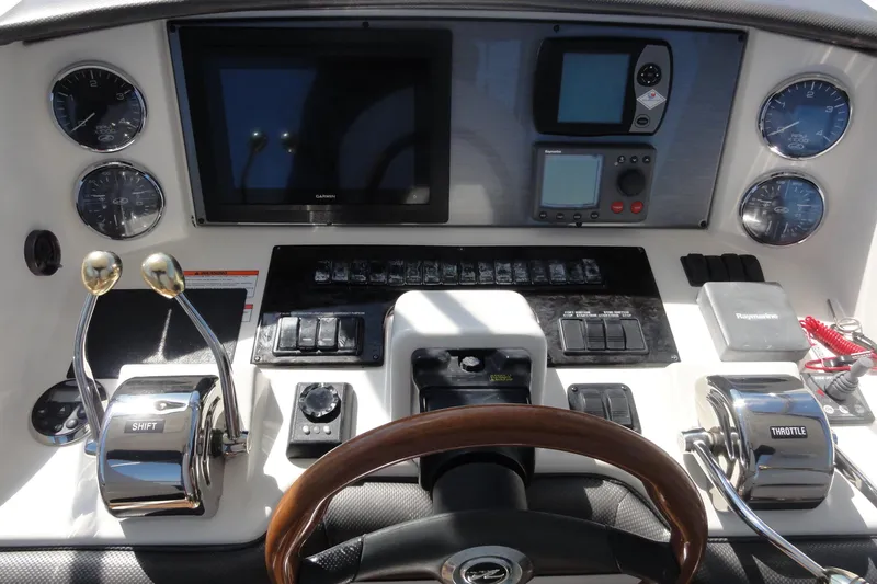  Yacht Photos Pics 2007 Sea Ray 36 Sedan Bridge helm with gauges, controls, and navigation equipment.
