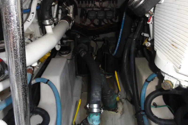  Yacht Photos Pics Engine room of a 2007 Sea Ray 36 Sedan Bridge with visible pipes and machinery.