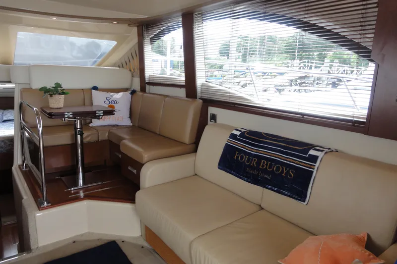  Yacht Photos Pics Luxurious interior of 2007 Sea Ray 36 Sedan Bridge with comfortable seating and decor.