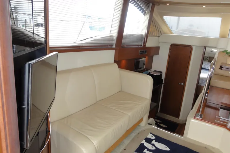  Yacht Photos Pics Interior of 2007 Sea Ray 36 Sedan Bridge yacht with beige sofa and modern amenities.