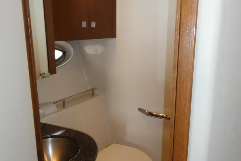  Yacht Photos Pics 2007 Sea Ray 36 Sedan Bridge bathroom with sink, cabinet, and porthole window.