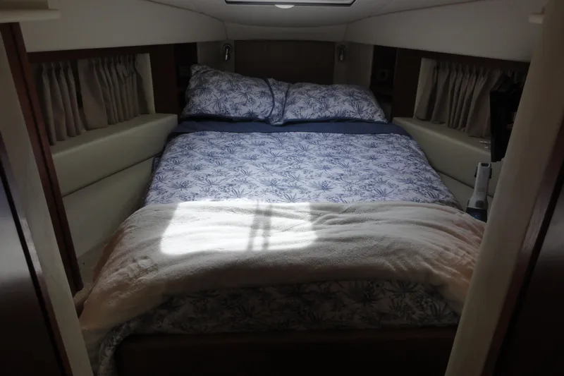  Yacht Photos Pics Cozy bedroom interior of 2007 Sea Ray 36 Sedan Bridge yacht with patterned bedding.